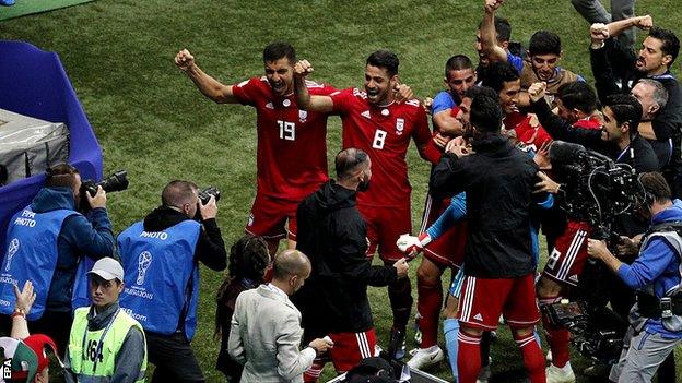 Iran celebrate a disallowed goal