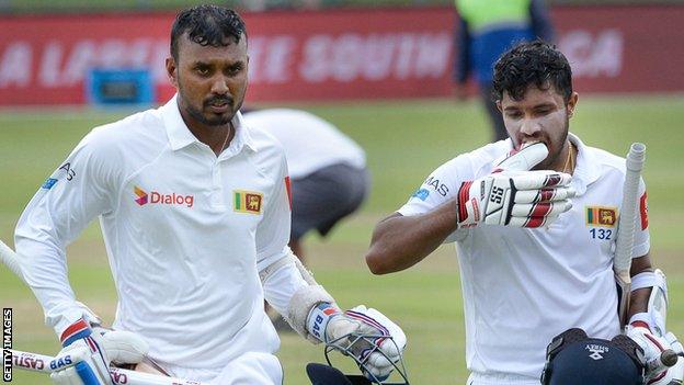 Oshada Fernando and Kusal Mendis walk off after Sri Lanka win the Test series