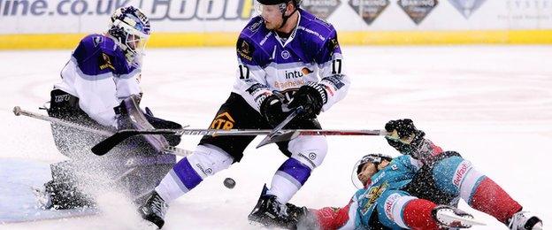 Gary Russell makes the save for the Clan as Adam Keefe slips onto the ice at the SSE Arena