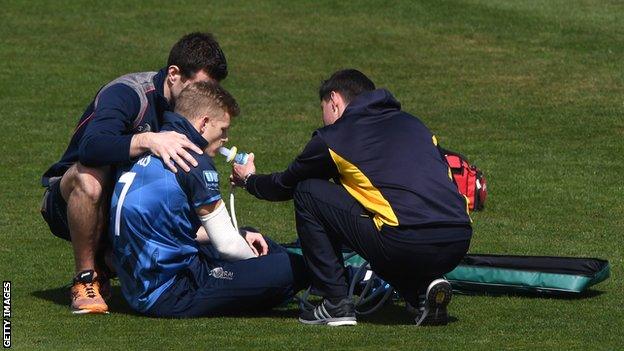 Sam Billings receiving treatment