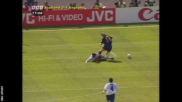 Tony Adams fouls Gordon Durie for Scotland's penalty