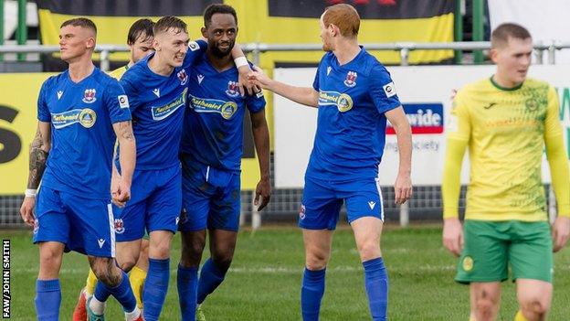 Penybont players congratulate Nathan Wood after his goal at Caernarfon