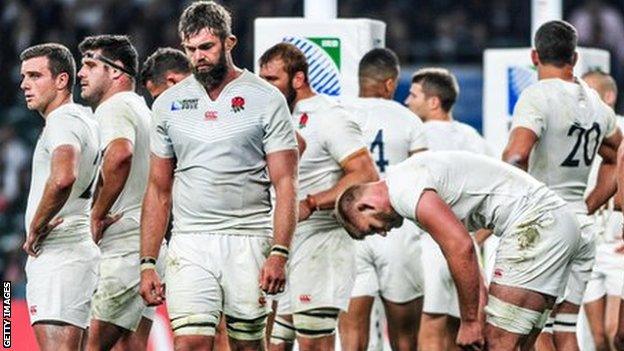 England players stand dejected