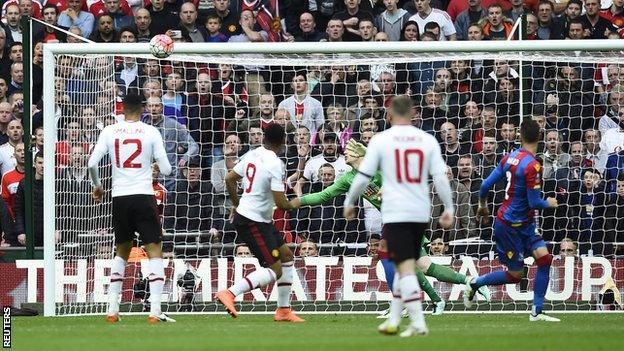 Manchester United forward Anthony Martial (number nine) looks on as his header hits the Crystal Palace woodwork