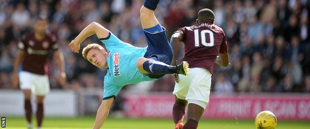 Hamilton's Greg Docherty and Hearts' Arnaud Djoum