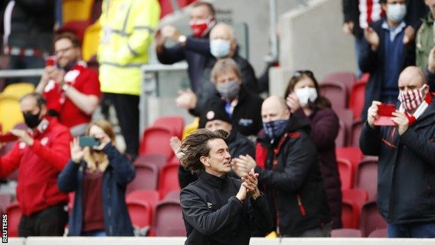 Brentford manager Thomas Frank applauds the fans before their play-off semi-final second leg against Bournemouth in May 2021