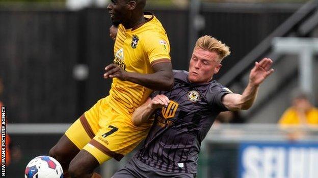 Will Evans in action against Sutton's Enzio Boldewijn