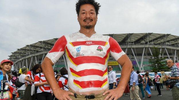 Japan fan with a painted-on national team shirt