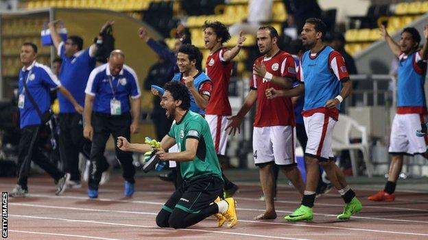 Yemeni players celebrate after winning their 2019 Asian Cup qualifier against Tajikistan in Doha