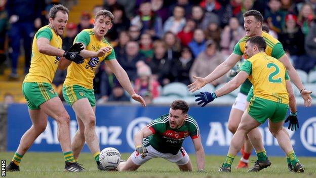 Mayo's David Drake is surrounding by four Donegal players at Ballybofey