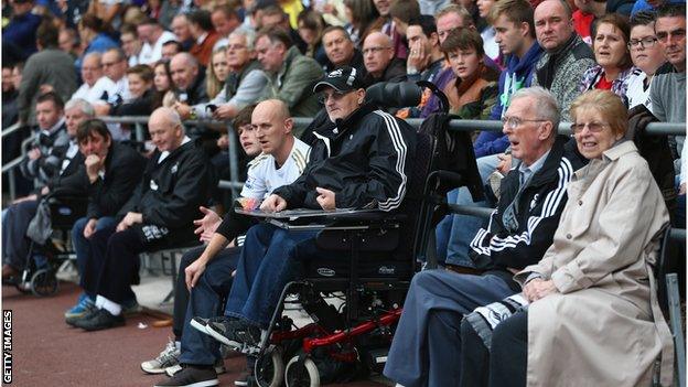 Disabled supporters of Swansea City look on during the Barclays Premier League match between Swansea City and Arsenal at the Liberty Stadium on September 28, 2013