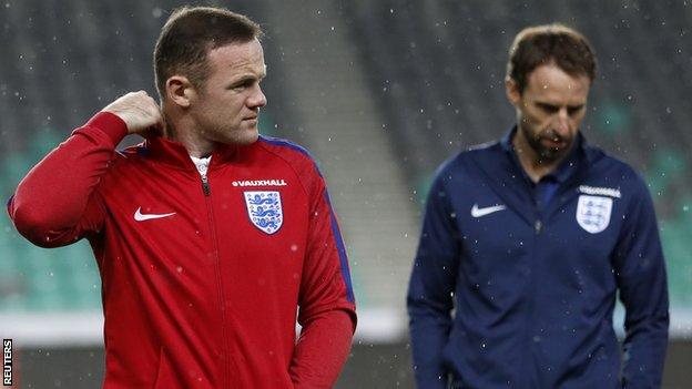 England striker Wayne Rooney (left) and manager Gareth Southgate