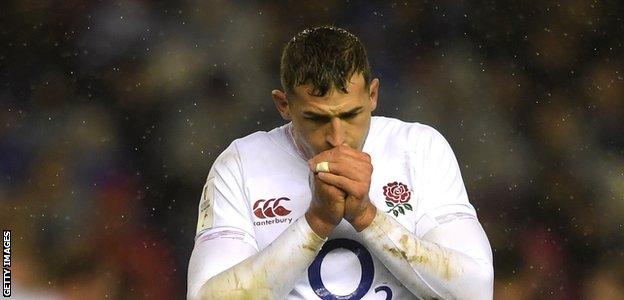 England wing Jonny May tries to keep warm