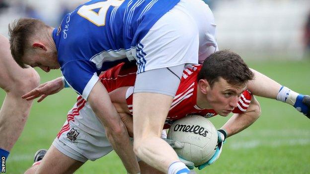 Cavan's Dave Phillips tackles Cork's Mark Collins