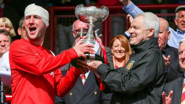 Brian Little and jersey captain Luke Watson lift the Muratti Vase in 2016