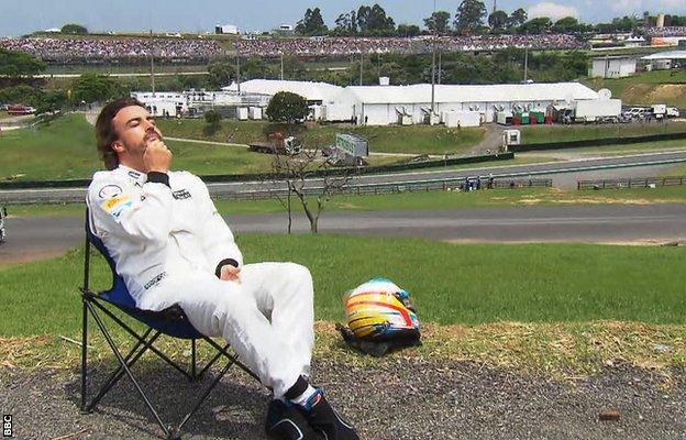 Fernando Alonso sunbathing at Interlagos