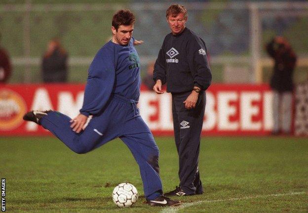 Manchester United training - Eric Cantona shoots on goal as Sir Alex Ferguson observes