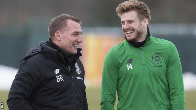 Celtic manager Brendan Rodgers talks to Stuart Armstrong in training