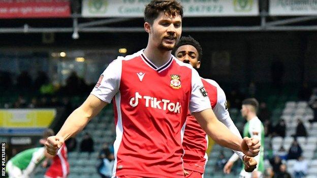 Jordan Davies celebrates a goal for Wrexham