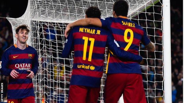 Lionel celebrates with team-mates Neymar and Luis Suarez after scoring against Real Sociedad