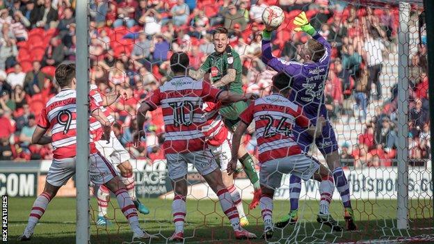 Sonny Bradley heads Plymouth's winner against Doncaster