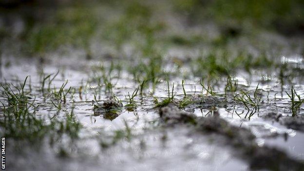 A very muddy grassroots pitch