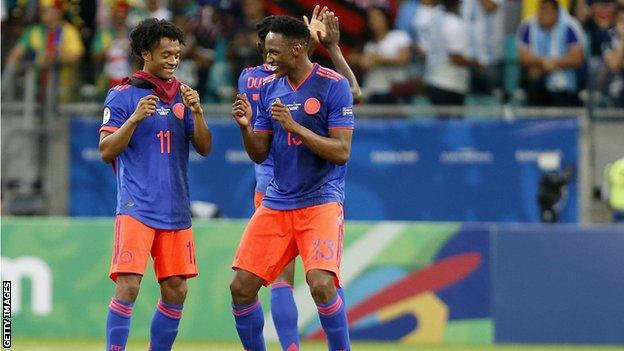 Colombia's Juan Cuadrado and Yerry Mina celebrate