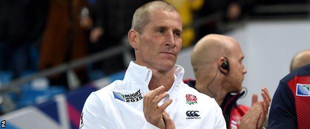 Stuart Lancaster applauds England's players off the field