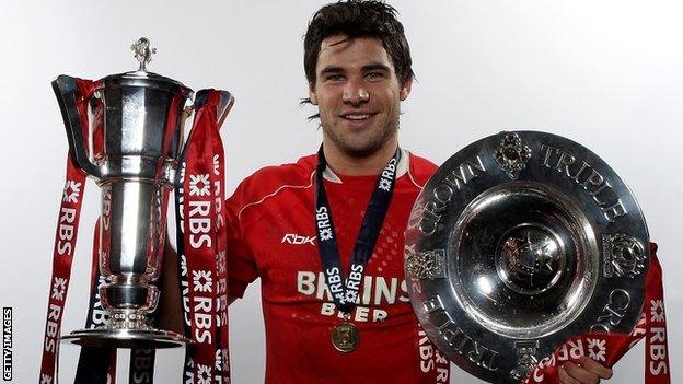 Mike Phillips with the Six Nations and Triple Crown trophies