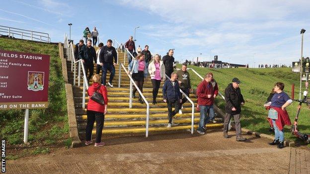 Fans arrive at Sixfields Stadium