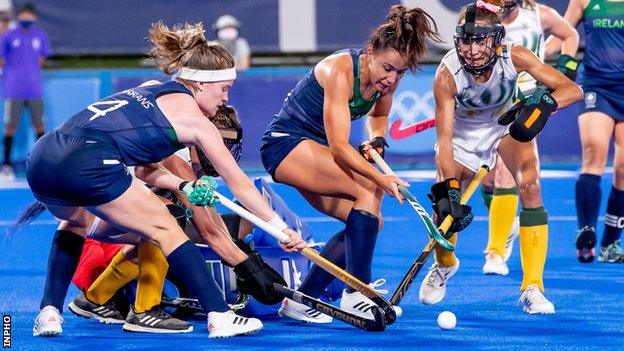 Ireland's Sarah Torrans and Anna O'Flanagan are involved in the goalmouth scramble in Tokyo