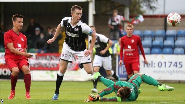 Chris Venables scores for Bala in the first leg at Rhyl's Belle Vue