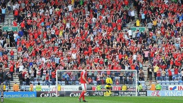 The scene behind the goal after Barnsley's equaliser at Wigan