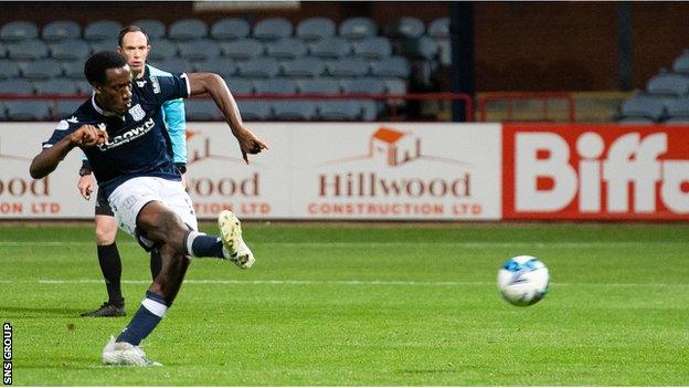 Dundee's Zach Robinson makes it 3-0 during a Premier Sports Cup match between Dundee and Falkirk at Dens Park