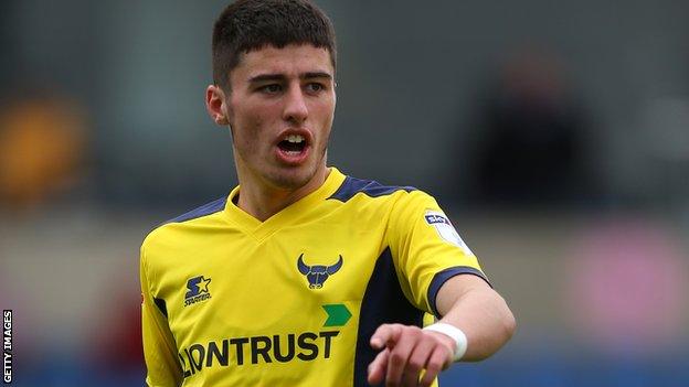 Canice Carroll in action for Oxford United