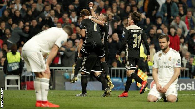 Real Madrid players look distraught as Ajax celebrate at the Bernabeu