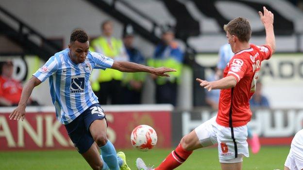 Coventry's Jacob Murphy is challenged by Walsall's Paul Downing