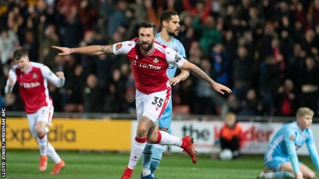 Ollie Palmer celebrates after scoring for Wrexham