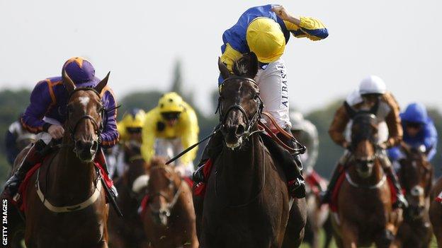 Jockey Oisin Murphy celebrates victory on Litigant at the Ebor handicap in York