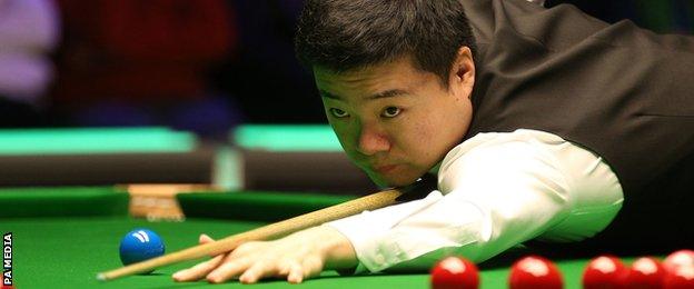Ding Junhui takes a shot