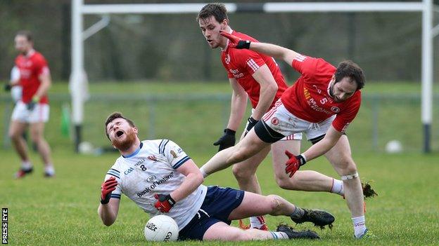 Tyrone's Ronan McNabb battles with Ulster University's Ruairi McGlone