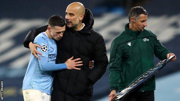 Pep Guardiola hugs Phil Foden