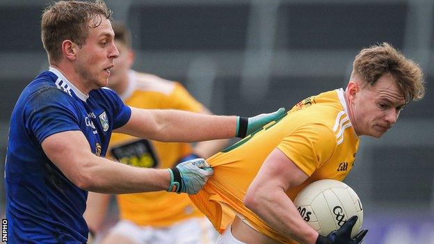 Cavan's Padraig Faulkner and Peter Healy of Antrim
