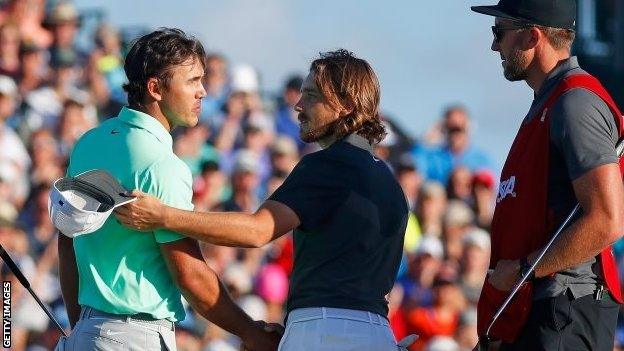 Brooks Koepka and Tommy Fleetwood on the 18th green