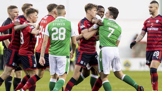 Hibs and Dundee players clash