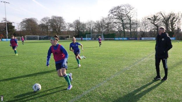 Kenny Shiels keeps a close eye on his players in training at Newforge