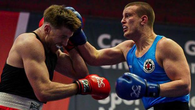 David Francis (R) lands a blow on Joshua Taylor