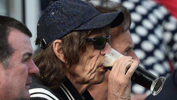 Sir Mick Jagger went full Irish with a drop of the black stuff as the Rolling Stones frontman watched the Malahide action