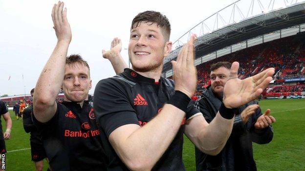 Rory Scannell and Jack O'Donoghue applaud the Munster supporters after the Irish province's win over the Scarlets