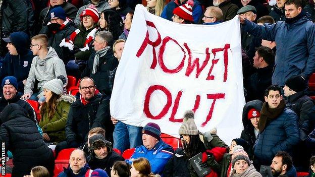 Stoke City fans display a "Rowett out" banner during their 2-0 loss to Bristol City